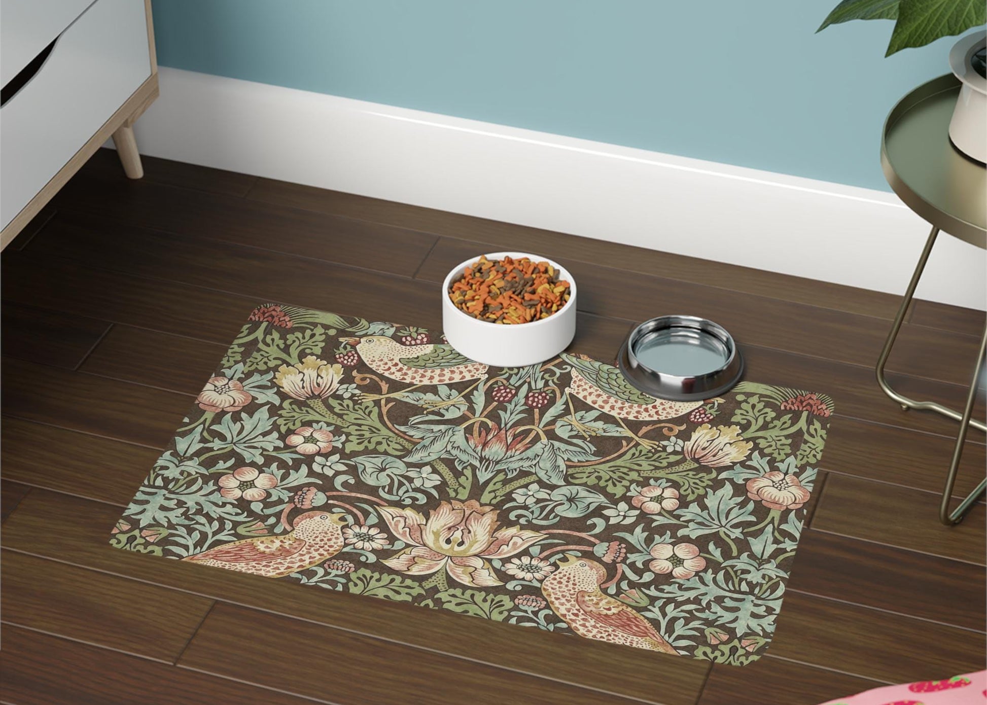 Decorative mat with floral and bird pattern on a wooden floor, featuring a bowl and water dish.