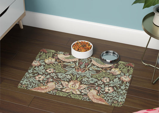 Decorative mat with floral and bird pattern on a wooden floor, featuring a bowl and water dish.